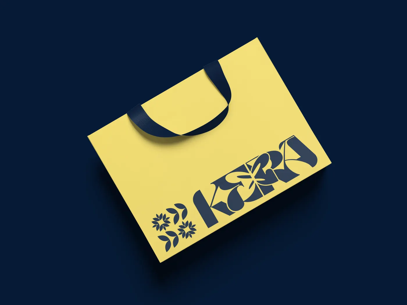 Yellow KERA tote bag with the navy KERA wordmark and the flower and leaf ornaments